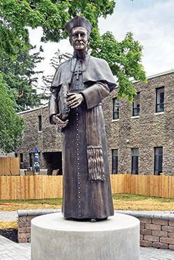 A newly created bronze statue of the Servant of God Bishop Simon Bruté is featured at the recently renovated back entrance of Bishop Simon Bruté College Seminary in Indianapolis. (Submitted photo)