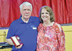 Jim Edwards smiles with his wife Diana after receiving an award from Catholic Charities Terre Haute for his 40 years as director of Ryves Youth Center in Terre Haute. Edwards, who retired on May 31, met Diana when she started volunteering at Ryves in 1983. (Submitted photo)