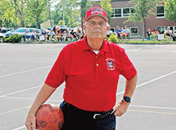 One of Mike LaGrave’s greatest joys in 50 years as an umpire is working kickball games for the archdiocese’s Catholic Youth Organization. (Photo by John Shaughnessy)