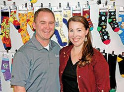 Scott and Elisabeth Williams strive to keep a leg up on everyone with their business, Sock Religious, “the world’s largest Catholic sock company.” (Photo by John Shaughnessy)