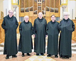 Benedictine Father Harry Hagan, left, Benedictine Brother Benjamin Brown, Benedictine Brother Zachary Wilberding, Benedictine Brother Martin Erspamer and Benedictine Father Denis Robinson pose in the Archabbey Church of Our Lady of Einsiedeln in St. Meinrad. They celebrated this year jubilees of profession of vows. (Photo courtesy of Saint Meinrad Archabbey)