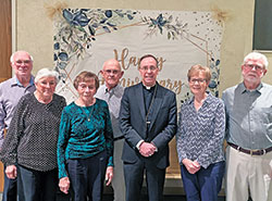 Richard and Nellie Peter, left, Ruth Ann and Robert Brumfield and Nancy and Bill Ludwig smile with Archbishop Charles C. Thompson during a reception following a Mass honoring milestone wedding anniversaries for couples of the Tell City Deanery at St. Paul Parish in Tell City on Oct. 29. (Submitted photo by Jane Hubert)