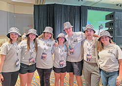 Members of the archdiocesan delegation to the 2022 National Catholic Youth Conference in Long Beach, Cal., on Nov. 10-12 show off their checkered flag bucket hats. They are Cheyenne Louagie, left, Sophia Delgado, Maria Serrato, Addie Gauck, Nick Belby, RJ Sturgill and Kaylee Smith. Cheyenne, Addie and Kaylee are members of St. Mary Parish in Greensburg, while the others are members of St. Luke the Evangelist Parish in Indianapolis. (Submitted photo)