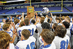 The football team of Bishop Chatard High School in Indianapolis celebrates its Class 3A state championship victory on Nov. 26 at Lucas Oil Stadium in Indianapolis after defeating the team from Lawrenceburg High School 34-14. (Submitted photo)