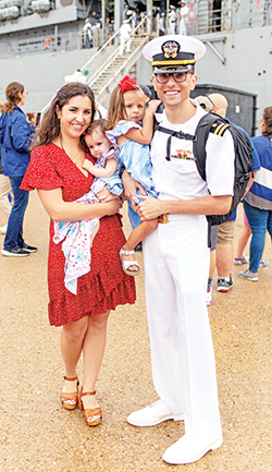 As a senior medical officer in the U.S. Navy, John Kennedy has overseen the care of about 800 U.S. sailors and Marines while being deployed in the Baltic Sea. Here, he shares a photo with his wife, Mary Kathryn (Allen) Kennedy and their two daughters, Vivian and Mary Eileen. (Submitted photo)