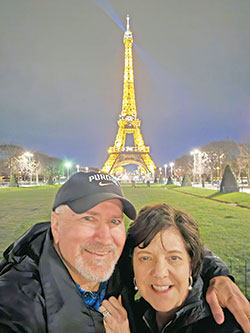 Mike and Rebecca Kirsch pose for a photo in front of the Eiffel Tower in Paris during a visit there in March. (Submitted photo)