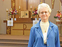 Franciscan Sister Shirley Gerth stands on May 31 in St. Maurice Church in Napoleon. She led the Batesville Deanery faith community as parish life coordinator since 2010. In July, she retired after serving 32 years in the archdiocese as a parish life coordinator. (Photo by Sean Gallagher)