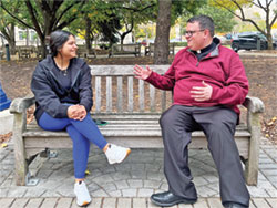 Father James Brockmeier, chaplain to the Catholic students of Butler University in Indianapolis, speaks with Butler student Stephanie Gonzalez on Oct. 25 on Butler’s campus. (Submitted photo)