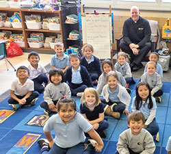 Father Timothy Wyciskalla enjoys spending time with students at St. Mark the Evangelist School in Indianapolis, giving him the opportunity to talk about God and faith with them. (Submitted photo)