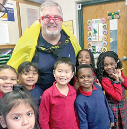 As the principal of St. Monica School in Indianapolis, Eric Schommer strives to connect with students through his faith and his interactions with them. (Submitted photo)