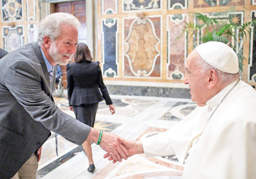 John Mundell, a member of Our Lady of Lourdes Parish in Indianapolis, greets Pope Francis during a June 2024 meeting at the Vatican. He serves as the global director of the Vatican’s Laudato Si’ Action Platform. (Submitted photo)