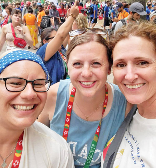 Rachel Gilman, center, director of youth ministry for the archdiocese, shares the joy of taking part in World Youth Day in Lisbon, Portugal, in 2023 with her friends, Marissa Paradiso. left, and Jen Linder. (Submitted photo)