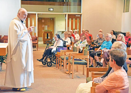 Father James Farrell preaches a homily during a June 4 Mass for the Benedictine sisters at Our Lady of Grace Monastery in Beech Grove. (Photo by Sean Gallagher)