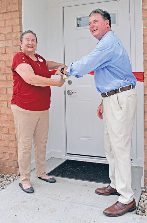 Linda Kile, then-president and executive director of Great Lakes Gabriel Project, and Indiana Attorney General Todd Rokita offer broad smiles as they prepare to cut a ribbon to officially open 1st Choice for Women pregnancy care center on the southwest side of Indianapolis on June 14. (Photo by Natalie Hoefer)