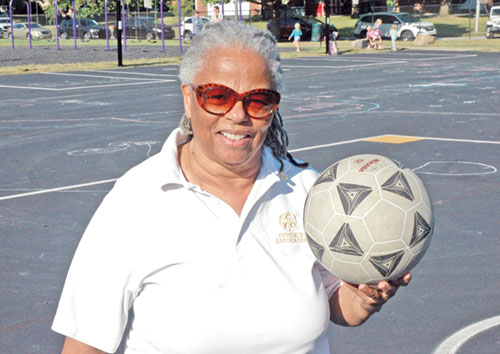 For more than 40 years, Rachel Mitchum has been a kickball umpire in the archdiocese’s Catholic Youth Organization, adding fun and sharing lessons in life with the girls who play the sport. (Photo by John Shaughnessy)