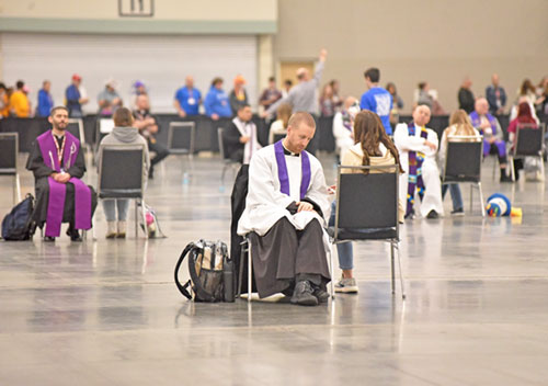 Priests hear confessions during the National Catholic Youth Conference in Indianapolis in November 2025. (Photo by Sean Gallagher)