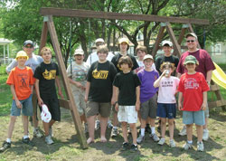 Volunteers pose for a photo after Phase 1 of the project. Charlie Cummings is fourth from right in the back row. (Photo provided)