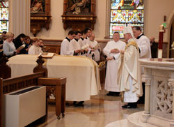 Bishop Kevin C. Rhoades incenses the casket of Msgr. J. William Lester at the Mass of Christian Burial at the Cathedral of the Immaculate Conception, Thursday, Feb. 25.