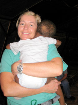 Ann-Marie Thomas holds the baby who was transported by helicopter into the hospital. At press time, Today’s Catholic learned that the child was reunited with his biological mother after his photo was featured in the Wall Street Journal.