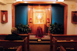 Photo caption: Adorers pray during perpetual adoration at St. Jude’s Adoration Chapel in Fort Wayne. The chapel is open 24 hours each day all year long.