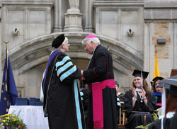 Saint Mary’s College President Carol Ann Mooney presents Bishop-emeritus John M. D’Arcy, with the prestigious President’s Medal at Saint Mary’s College’s 163rd Commencement held on Saturday, May 15. The medal is presented rarely and exclusively to those who have offered exceptional contributions to the life of the college and society. As bishop, he engaged in ongoing dialogue with four Saint Mary’s presidents, and in 1991, Bishop D’Arcy received an honorary degree from the college. Bishop D’Arcy participated regularly in campus events and enjoyed a climate of trust, mutual understanding and shared vision with the college. Also receiving a President’s Medal was John O’Connor of New Canaan, Conn., the outgoing chair of the college’s board of trustees.