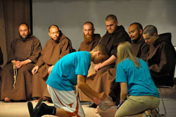 During the final day of the retreat, the teens showed their gratitude to the Franciscan Brothers Minor by washing their feet. Travis Rauwerdink, left, and Samantha Baus are shown washing Bother Solanus’ feet. Brothers in the photo are from left, Father David Engo, superior, Brother Juniper, Bother Felix, Brother Lawrence and Brother Leo Maria.