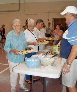 More than 100 people now attend each week’s dinner at St. Bernard Parish in Crawfordsville. (Photos by Caroline B. Mooney)