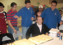 Jorge Gomez, a seminarian at the time, enjoys a birthday celebration with members of the Hispanic community in Dale. (Message photo courtesy Guadalupe Center)