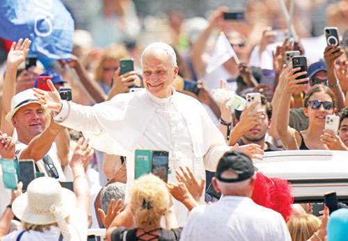 Pope Leo XIV greets people as he rides in the popemobile in St. Peter’s Square after celebrating Mass for the conclusion of the Jubilee of Sport in St. Peter’s Basilica at the Vatican on June 15. (CNS photo/Lola Gomez)